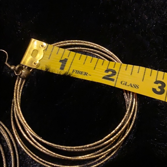 Fuego Gold Tone Hoop Earrings - Picture 6 of 6